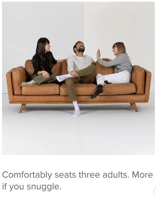3 people sitting on a sofa
